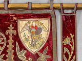 a red and gold banner hanging on a wall
