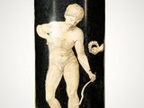 black and white vase with a statue of a man holding a flower