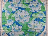 an image of a blue and green floral print scarf