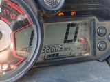 a close up of a speedometer on a motorcycle