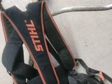 a picture of a pair of gloves and a tool on the floor