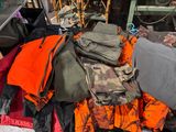 a pile of clothing that is sitting on the ground
