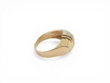 a close up of a gold ring with a diamond on it