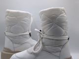 the white boots are lined up and ready to be worn