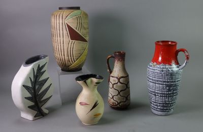 five vases that are sitting on a table