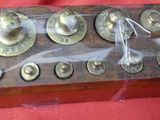 a wooden box that has a bunch of buttons on it