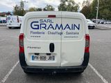 a white van that is parked in a parking lot