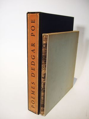 two books are stacked on top of each other on a white surface