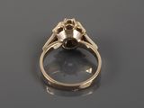 a close up of a gold ring with a skull on it