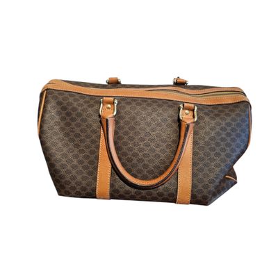 a brown and black handbag on a white background