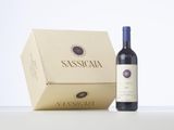 a bottle of wine sitting next to a box of wine