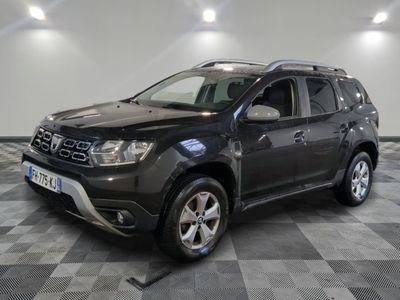a picture of a black suv parked in a garage