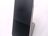 a cell phone that is sitting on top of a stand