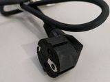 a close up of a cable connected to a power cord on a table