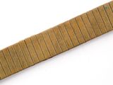 a close up of a wooden strip on a white surface