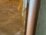 a close up of a door with a wooden handle