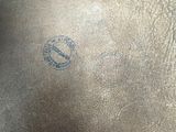 a close up of a horse ' s saddle with a stamp on it