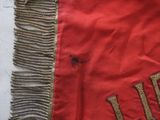a close up of a piece of cloth with a fringe on it