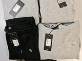 three pairs of men ' s grey and black sweatpantss and a pair of black sweatpants