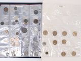 two bags of coins sitting next to each other on a table