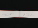 an open book with a drawing of a plane on it