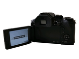 a digital camera that is open to show the screen