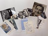 a lot of old photos and postcards on the table