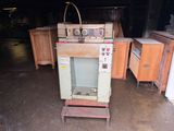 an old oven sitting in the middle of a garage