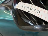 a sticker on the side mirror of a car that says vauto