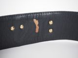 a close up of a black leather belt with gold buttons