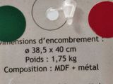 a label on the back of a bottle with a red, green, and white label