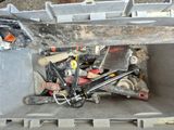 a toolbox full of tools sitting on the ground