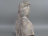 an image of a stone statue of a person with a hat on his head