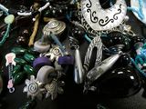 a close up of a bunch of jewelry on a table