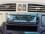 a car dashboard with a radio and other electronics in it