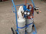 a blue cart with two propane gas cylinders on it