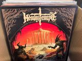 a black vinyl album with a picture of a demon and a demon on it