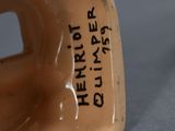 a close up of a vase with writing on it