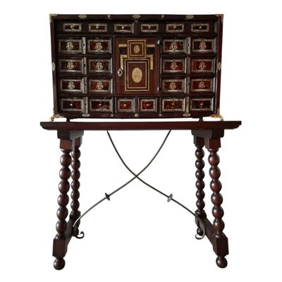 an image of a wooden table with drawers on top of it
