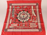 a red scarf with a picture of a group of people on it