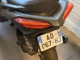 a scooter that is parked in a garage