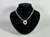 a close up of a necklace on a mannequin display