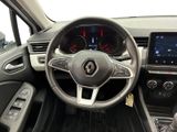 a picture of the interior of a car with a steering wheel and dashboard