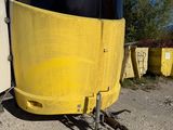 a yellow trailer that is parked in the dirt