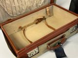 a suitcase that is open on a white table