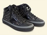 black high top sneakers with stars on them on a white background