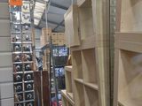 many shelves that are in a room with a lot of boxes
