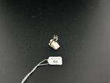 an image of a piece of metal with a tag attached to it