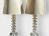 pair of crystal table lamps with lampshads on each of them
