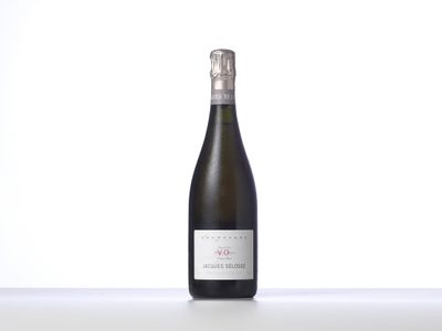 a bottle of wine that is sitting on a table